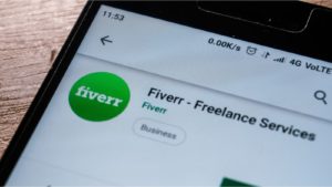 The Fiverr website displayed on a mobile phone screen. - 7 Sorry Tech Stocks To Sell In February Before It's Too Late