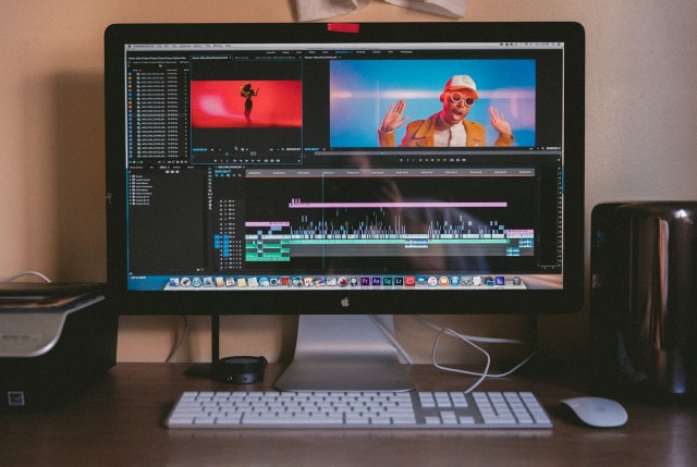 turned on iMac and Apple Magic Keyboard and mouse on table - Unlock Your Video Editing Potential With Fiverr Why You Need It Now!